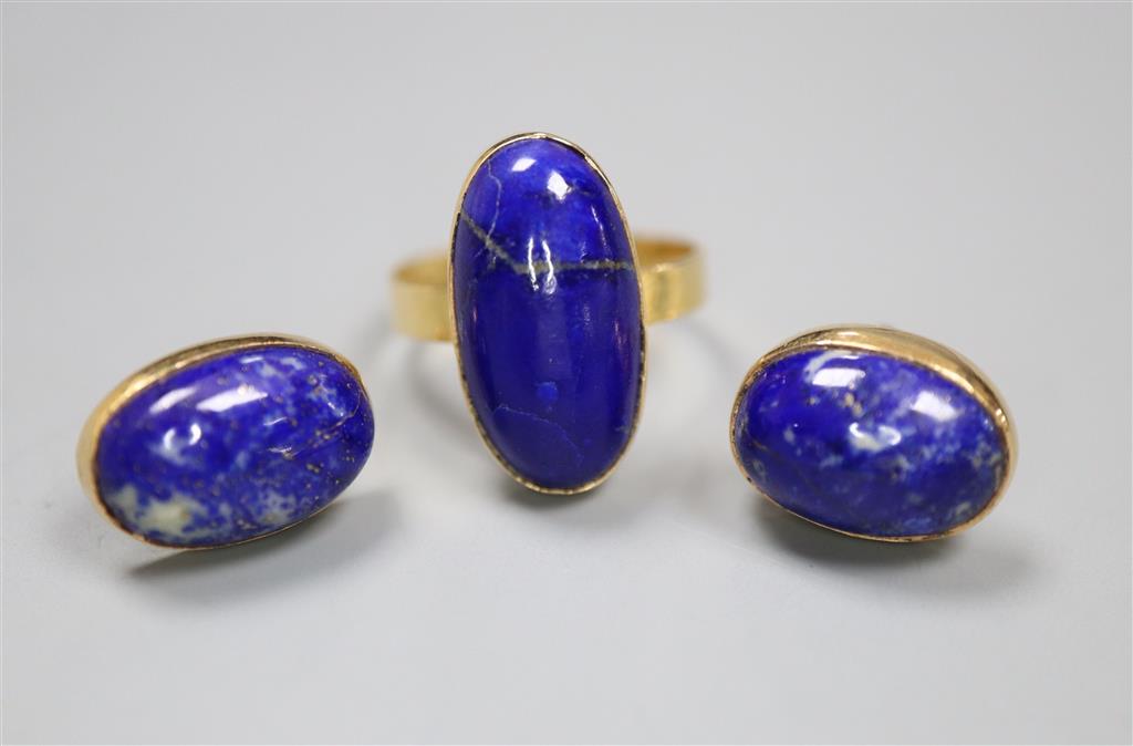A Middle Eastern yellow metal and lapis lazuli oval dress ring, size N, and pair of matching earrings, gross 8.7 grams.